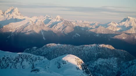 Telephoto-footage-of-a-snowy-mountain-range-in-BC,-Canada