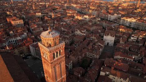 Venice-Italy-Aerial-View-at-Cathedral-Church-Cusp-and-City-at-Dusk-Time,-Warm-Summer-Feeling-with-Adriatic-Sea-Horizon,-European-Travel-Destination