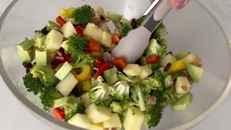 Broccoli-Salad-Mixed-With-Chopped-Vegetables,-Fruits,-And-Nuts