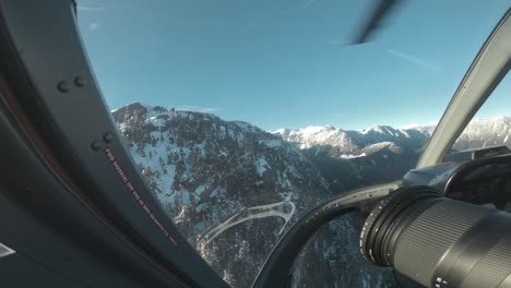 POV-of-a-guy-taking-photos-in-the-front-seat-of-a-helicopter-in-Canada,-BC