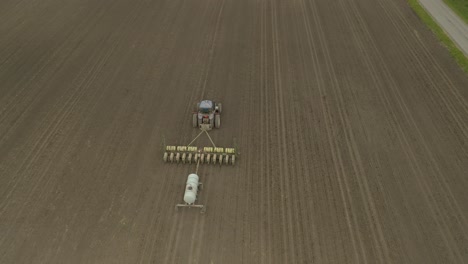 Farmer-in-tractor-planting-crop-in-field-take-7