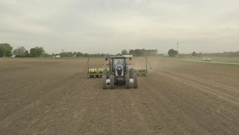 Farmer-in-tractor-planting-crop-in-field-take-6
