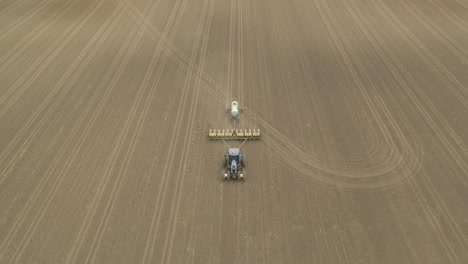 Farmer-in-tractor-cultivating-crop-in-field-take-14