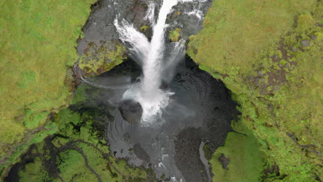 Aerial:-Top-down-shot-of-beautiful-Kvernufoss-waterfall-in-Iceland