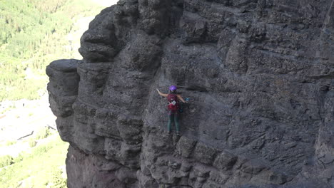 Young-Woman-on-Adventurous-Climbing-Route-Moving-on-Steep-Cliff-Using-Ropes-and-Cables