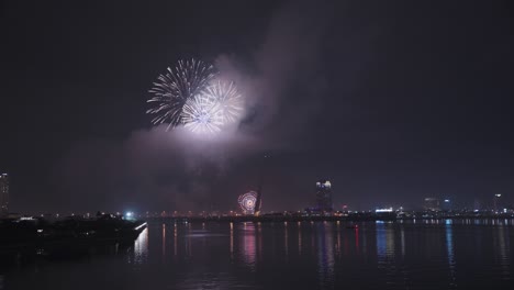 Beautiful-fireworks-light-up-sky-for-Lunar-New-Year-and-Tet-holiday-over-Han-River-in-Danang,-Vietnam