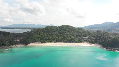 Rising-drone-over-hidden-Pansea-Beach-in-Phuket,-Thailand