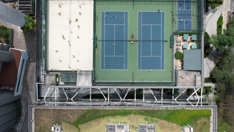 Top-view-of-tennis-court-in-mid-town