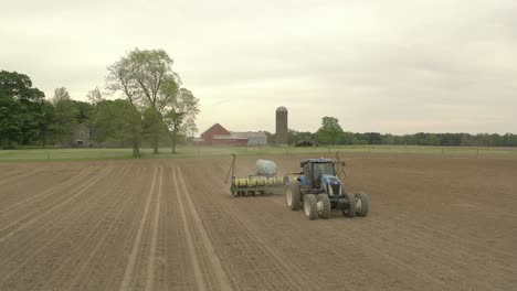 Farmer-in-tractor-cultivating-crop-in-field-take-10