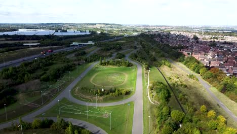 Drone-rising-over-cycling-track-in-London-suburb