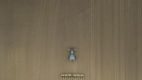 Farmer-in-tractor-cultivating-crop-in-field-take-12