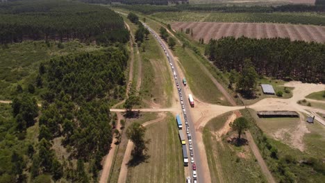 Traffic-jam-along-rural-Gualeguaychu-Fray-Bentos-road,-border-between-Argentina-and-Uruguay