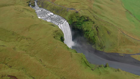 Aerial-orbit-shot-of-beautiful-Skogafoss-waterfall-in-Iceland