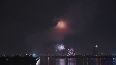 Fireworks-for-Lunar-New-Year-and-Tet-holiday-over-the-water-of-Han-River-in-Danang,-Vietnam