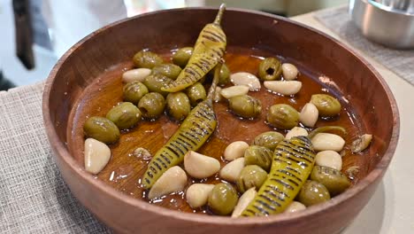 Grilled-green-olive,-Garlic-and-Green-Chilli-pickles-are-displayed-during-the-Gulf-Food-exhibition-2023