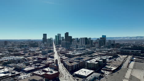 Bluebird-winter-day-over-City-of-Denver,-Colorado---skyline-view-aerial-dolly