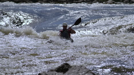 Silhouette-of-white-water-rapids-and-kayak-extreme-sports