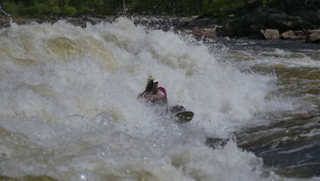 Extreme-sports-white-water-kayak-splashing-in-the-wave