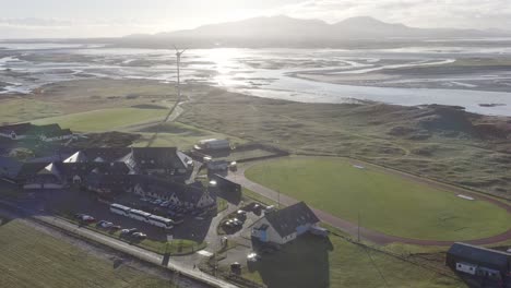 Drone-shot-of-Benbecula,-focusing-on-the-landscape-around-the-Dark-Isle-Hotel