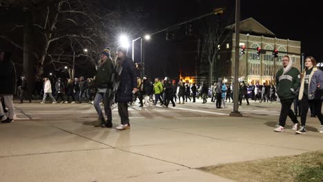 Michigan-State-University-Mass-Shooting-Vigil-wide-night-walking-by
