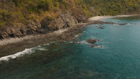 Flying-Through-Rugged-Coast-In-Tropical-Beach-Of-Costa-Rica,-Central-America