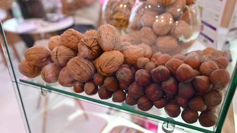 Closeup-of-Walnuts-and-Hazelnuts-are-displayed-during-the-Gulf-Food-exhibition,-United-Arab-Emirates