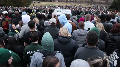 Mass-Shooting-Vigil-Michigan-State-University-people-and-rock-right-to-left