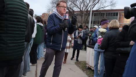 Michigan-State-University-Mass-Shooting-Vigil-reporter-talking
