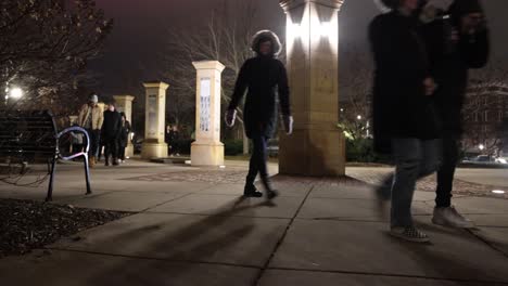 Michigan-State-University-Mass-Shooting-Vigil-wide-people-walking-through-campus