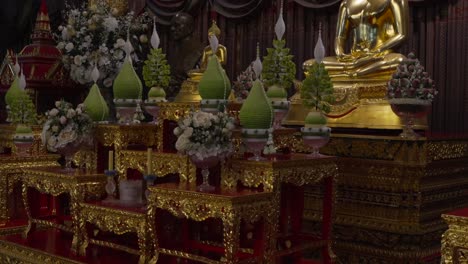 Buddha-shrine-at-Wat-Paknam-Bhasicharoen-Bangkok-Thailand-side-tilt-shot