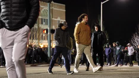 Mass-Shooting-Michigan-State-University-Vigil-people-walking-away-from-vigil