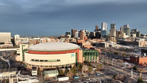 Aerial-pullback-view-of-Ball-Arena-and-City-of-Denver-buildings-in-background