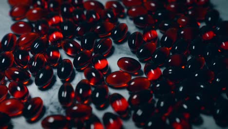 Red-krill-oil-capsules-being-illuminated-by-a-passing-light-source
