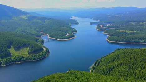 Aerial-drone-footage-of-a-Oasa-Lake-from-Sureanu-mountains,-Alba-county,-Transalpina,-Transylvania,-Romania