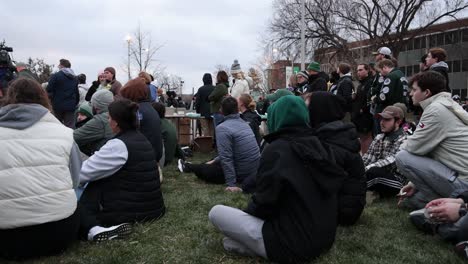 Michigan-State-University-Mass-Shooting-Vigil-people-siting-from-side