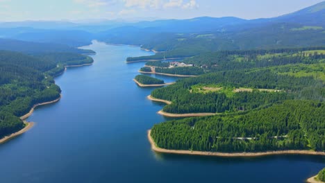Aerial-drone-footage-of-a-Oasa-Lake-from-Sureanu-mountains,-Alba-county,-Transalpina,-Transylvania,-Romania