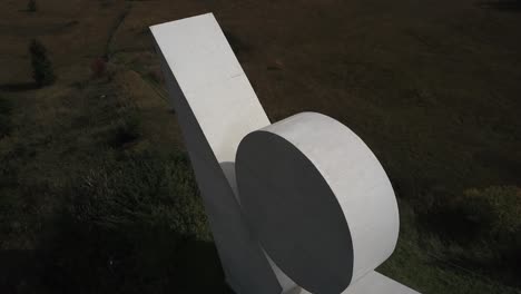 Aerial-drone-orbiting-over-national-resistance-monument,-Plateau-des-Glières-in-Haute-Savoie,-France