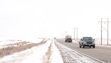 Traffic-passes-and-a-Walmart-truck-drives-past-on-a-cold-winter-highway