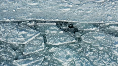 Aerial,-cracked-polar-ice-sheet-caused-by-global-warming,-concept-of-climate-change