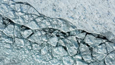 Aerial-top-down,-cracked-polar-ice-sheet-path-caused-by-icebreaker-ship