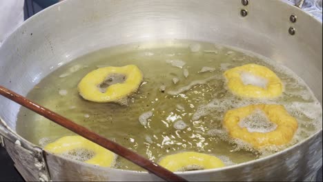 Frying-Picarones-a-typical-traditional-dessert-in-Peruvian-Food