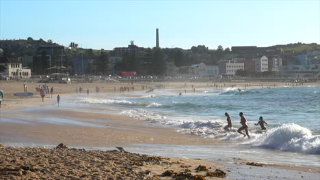 Beach-goers-enjoying-the-ocean-at-Bondi-Beach,-Sydney-Australia
