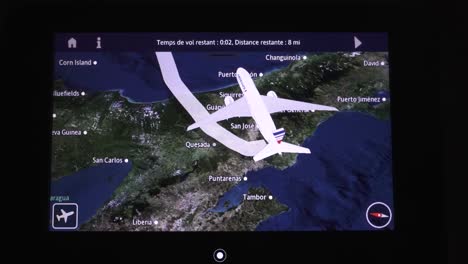 Navigation-monitor-inside-Air-France-777-jet-about-to-land-at-main-airport,-Handheld-close-up-shot