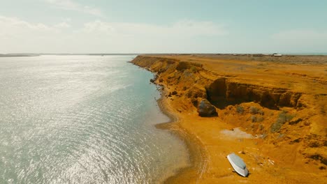 Aerial-view-flying-over-the-beach-in-the-desert,-Colombia,-la-guajira,-punta-gallinas