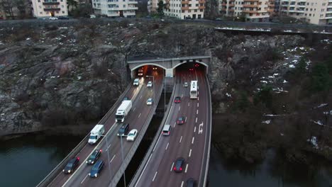 Parallaxing-drone-shot-over-Stockholm-freeway-tilt-up-towards-skyline