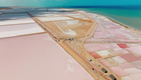 Aerial-Drone-shot-of-a-Salt-flat-going-to-the-ocean,-Colombia,-La-Guajira