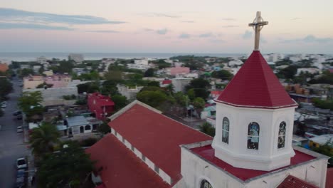 From-the-top-of-a-beautiful-church-in-the-heart-of-a-picturesque-seaside-town,-Playa-del-Carmen