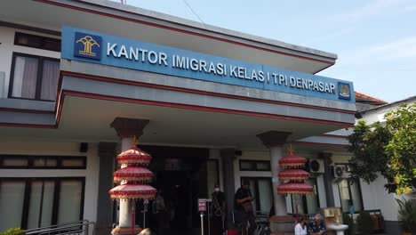 Immigration-Office-Building-in-Denpasar,-Bali,-Indonesia,-Entrance-Door,-people-arrive-for-Visa-and-Migration-Services,-Kantor-Nugrah-Rai
