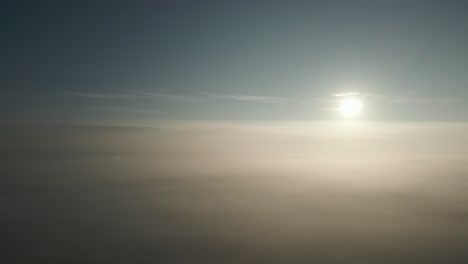 Sun-Above-The-Clouds-Aerial-Panning-Shot