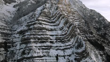 Tilt-Shot-of-Snowy,-Jagged-Mountain-Face-in-Provo-Canyon-Utah